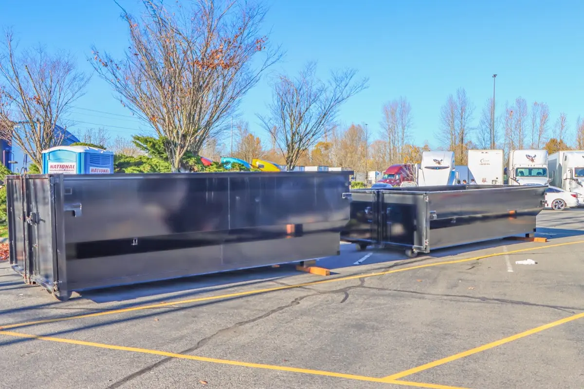 Professional dumpster rental service with roll-off container on residential driveway in Tumwater